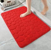 Red non-slip bathroom toilet mat with honeycomb pattern, highly absorbent and soft for safety and comfort
